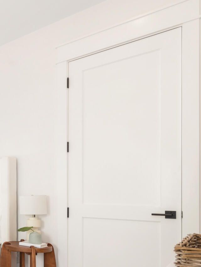 White two-panel interior door hung and cased, West Palm Beach