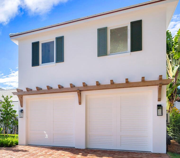 Custom wood pergola mounted to the wall above a two-car garage, West Palm Beach