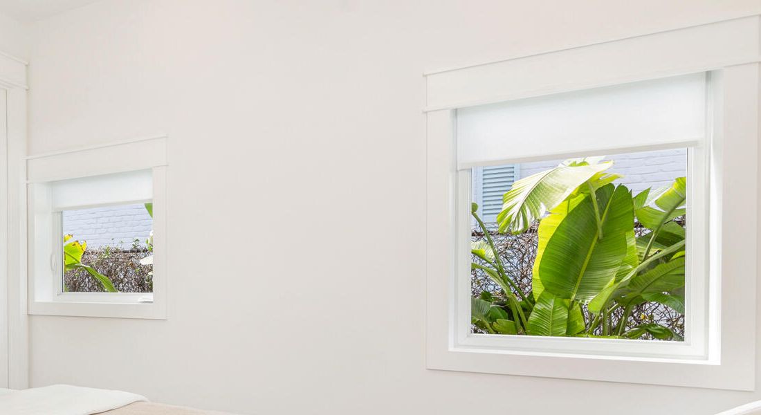 Two bedroom windows finished with white casing, West Palm Beach